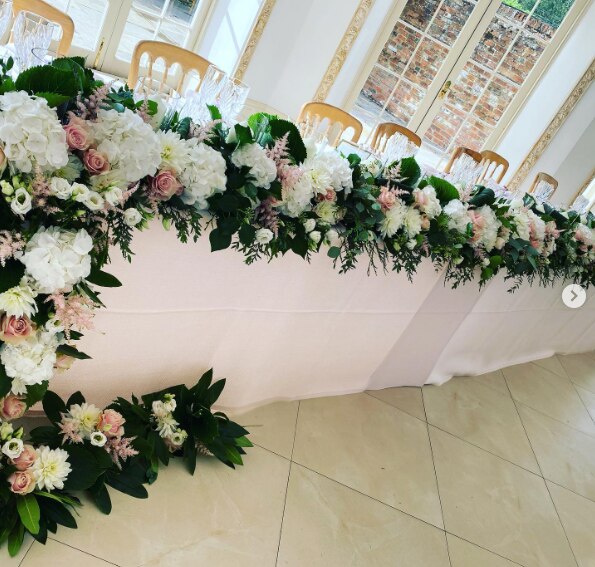 A beautiful top table arrangement of flowers